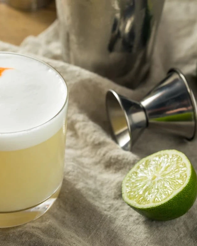 Discover the classic Pisco Sour cocktail made with fresh lime juice, smooth pisco, and a silky egg white foam. A refreshing and iconic South American drink.
