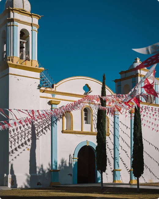 Village church decorated with papel picado